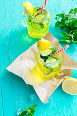 Lemonade drink in a jar glass on wooden background