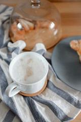 A cup of coffee on a kitchen towel
