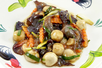 Thai traditional cuisine roasted mushrooms with dill on the white plate isolated on white background, asian eating food, Thai food, close up