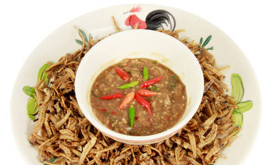 Thai cuisine Fried fish and Spicy Chili Paste (Thai name is Nam Prik) serve with vegetables  isolated on white background, asian eating food, Thai food, close up