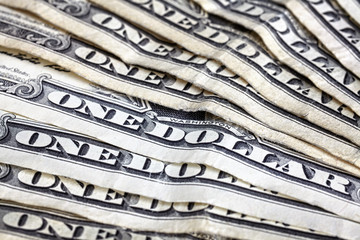Close up of old one dollar bills, shallow depth of field