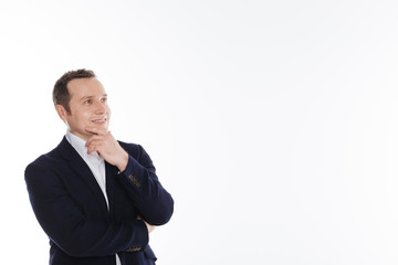 Brilliant emotional gentleman looking at something with fascination