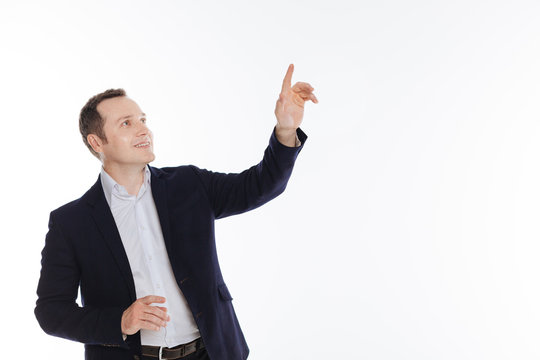 Enthusiastic classy gentleman pointing at something