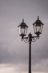 Fototapeta na wymiar Vintage Street Lamp with Early Raining Background in the Evening