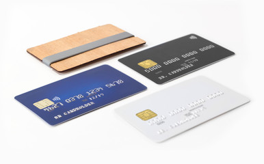 Three blank credit cards and stylish wooden card holder