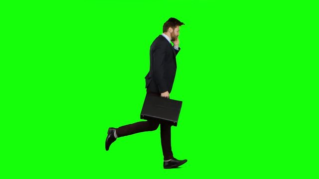 Man is running to work, understands that he is late and begins to run. Green screen