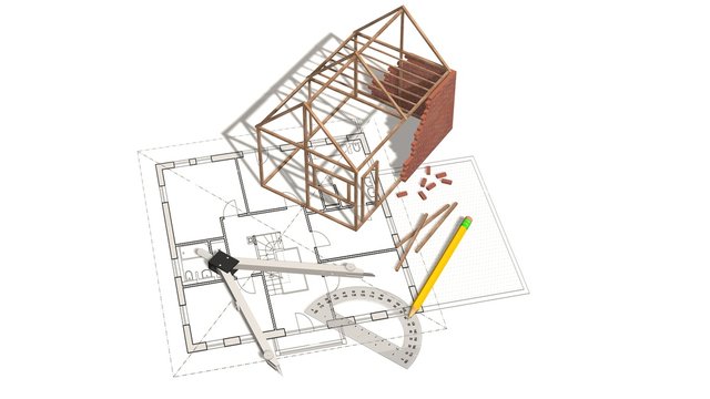 House project - house under construction on blueprint - concept for construction industry