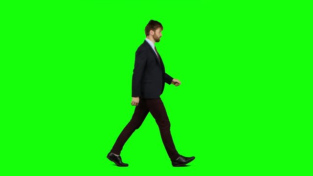 Man walks calmly down the street, he is happy. Green screen