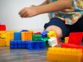 Details of the toy construct on the background of the playing child