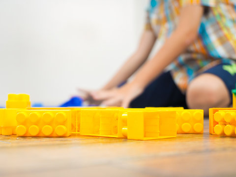 Details of the toy construct on the background of the playing child