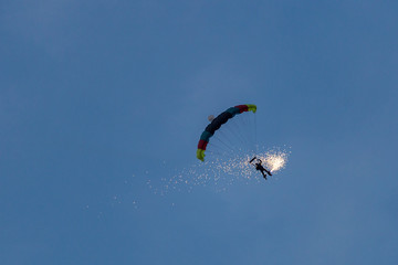 parachute jumper with fire on legs