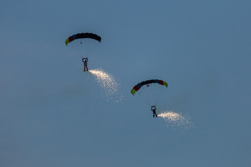 parachute jumper with fire on legs