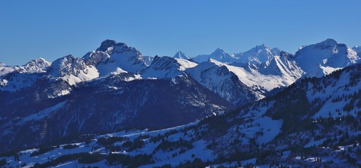 Fototapeta na wymiar Snow covered mountains seen from mount Rellerli, Switzerland.