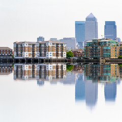 Canary Wharf, a major financial district in London, and its reflection from river Thames