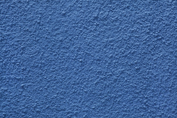 Blue painted stucco wall.