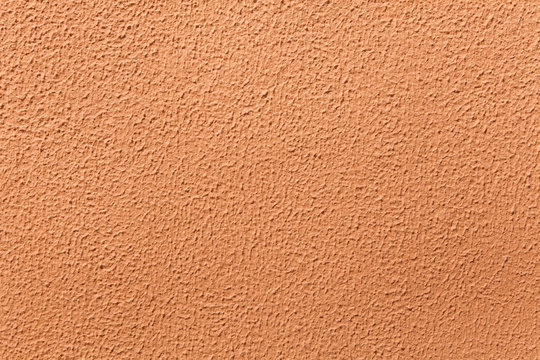 Terracotta painted stucco wall.