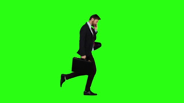 Man goes to work, understands that he is late and begins to run. Green screen. Slow motion