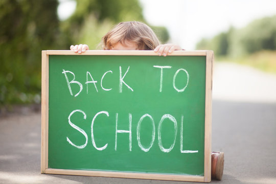 Little girl frightened and unhappy back to school