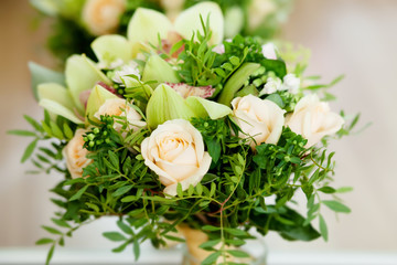 Wedding bouquet with roses and green cymbidium orchids