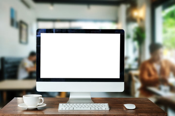 Computer Monitor, Keyboard,coffee cup and Mouse with Blank or White Screen Isolated is on the work table in the coffeeshop 
