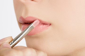 beautiful female lips with pink colored macro close-up