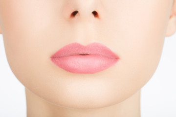 Beauty face closeup. Sexy lips. Beauty pink lip makeup detail. Beautiful make-up close-up. Sensual open mouth. Lipstick and lipgloss
