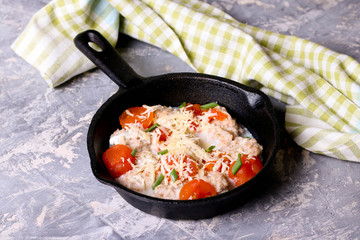 Homemade gnocchi with tomato sauce in frying pan