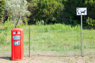 Sign to clean up after dog pooping.Pet Waste Station .
