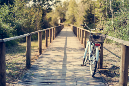 Fototapeta Bicycle with basket on the bicycle path.