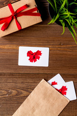 concept of gift cards on wooden background top view