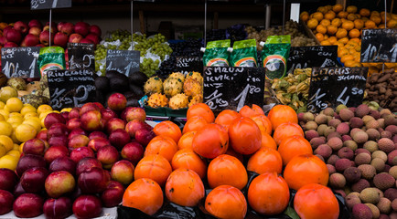 Colourful fresh fruit and vegetables on display in street market