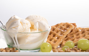 Belgian waffles, ice cream, walnuts and grapes