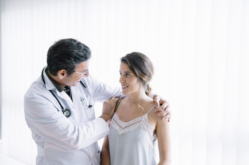 Male doctor with female patient