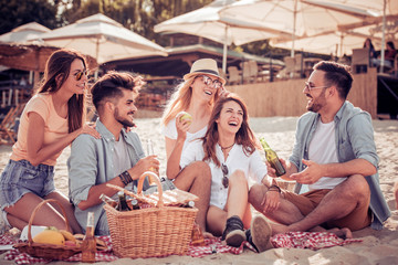 Group of friends having fun at the beach