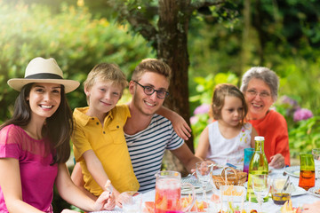 Three members of the same family posing for a photo