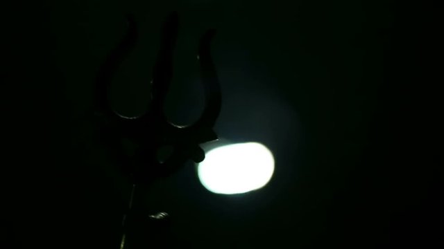 Trishul - a symbol of Hindu god Shiva. Trident is a Mahadeva symbol. Lord Shiva`s Trishul In the water of the sacred lake Shiva and his wife Pravati in Mahashivaratri puja.