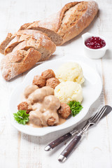 Traditional meatballs with sauce and mashed potatoes