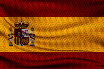 Fototapeta premium National flag of Spain on wavy fabric with a volumetric pattern of hexagons. Vector illustration.
