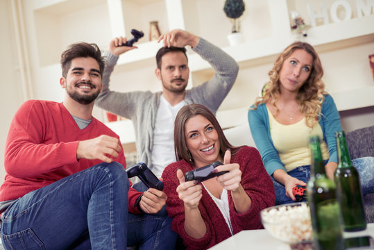Group of friends playing video game together.