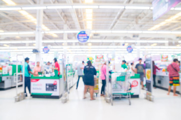 Fototapeta na wymiar Abstract Blur or Defocus Background of People Pay money in Supermarket.