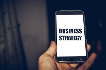 business strategy written on mobile phone