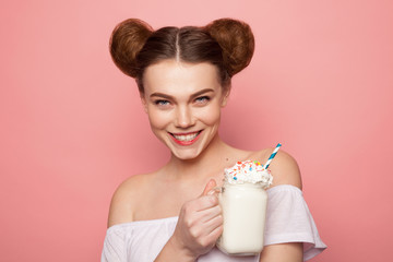 Young girl posing with milk shake