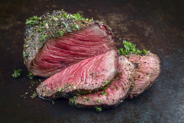 Barbecue Wagyu Point Steak sliced as close-up on an old board