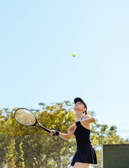 Sportswoman playing tennis on court