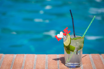 Cocktail at the edge of swimming pool
