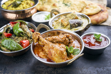 Traditional Indian Curries and Biryani with Mango Chutney and Pita Bread as top view