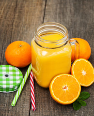 Naklejka na ściany i meble Jar with orange juice