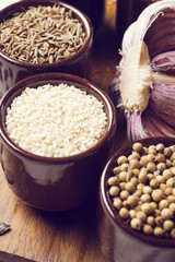 Spices and herbs in ceramic bowls. sesame seasoning. Colorful natural additives.