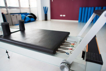 Fototapeta na wymiar Empty hall with modern equipment for pilates training