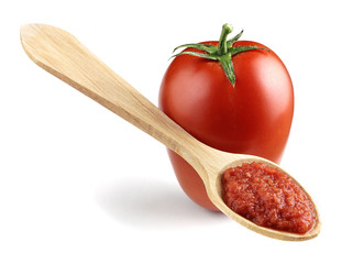 tomato with wooden spoon
